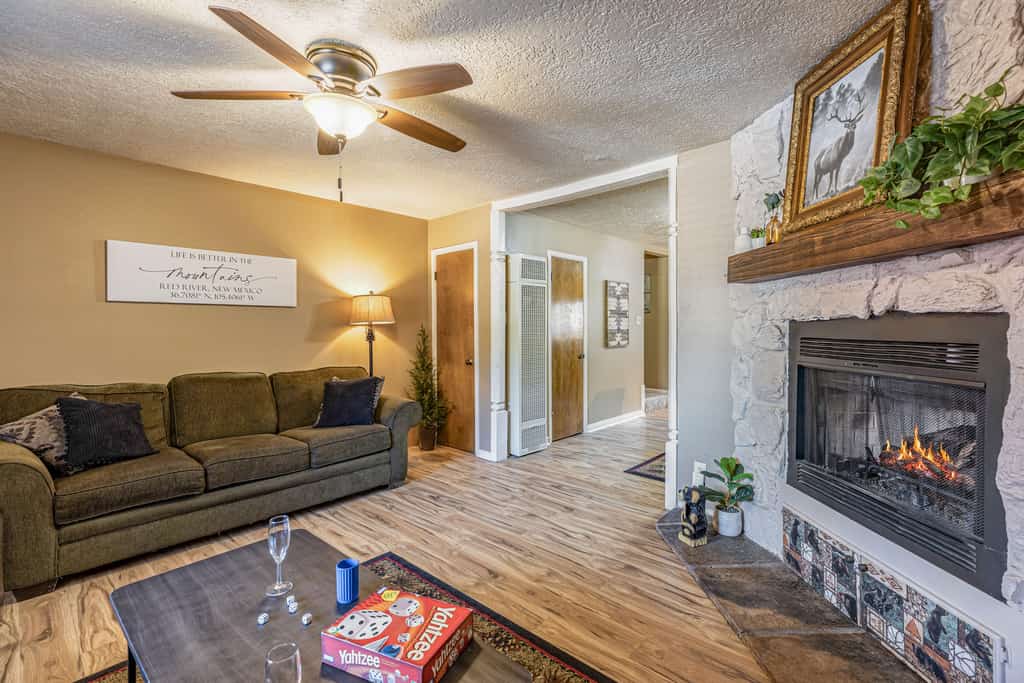 Welcome to Tenderfoot Retreat, a two-story condo tucked along Pioneer Creek about a mile from downtown Red River and the ski area. Two private suites each offer their own bath and balcony, and a sleeper sofa brings the group to six. Cook in the full kitchen, gather by the gas fireplace for game night, and soak in the community spas after a day of skiing, hiking, or festivals. With forest and mountain views from two balconies, it is an easy, comfortable mountain basecamp in every season.