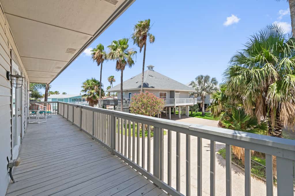Welcome to Casa de Cielos Azure, a waterfront retreat in Long Island Village, a gated resort community on the Laguna Madre just minutes from South Padre Island. Fish from the private dock, take in the water from wraparound covered decks, and cook in a chef's kitchen with quartz counters. Four bedrooms and four full baths sleep 8, with resort pools, hot tubs, golf, tennis, mini golf, and a marina all inside the gates. On launch days, watch SpaceX light up the sky across the water.