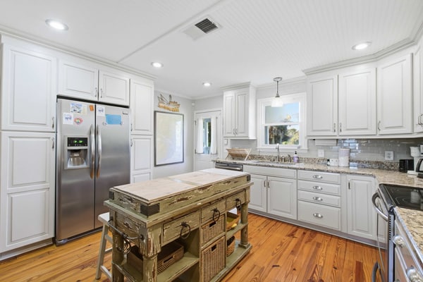 Edisto Beach Getaway is a charming 4-bedroom, 2-bath classic beach cottage tucked away on a quiet, tree-lined street just a short walk from the ocean. Sleeping up to 10 guests, this cozy retreat combines timeless coastal charm with modern comforts, making it an ideal getaway for families and groups.
Enjoy a spacious yard, ample parking for cars and boats, a relaxing screened porch, an enclosed outdoor shower, and a comfortable under-house gathering area. Inside, the open-concept living, dining, and kitchen space provides plenty of room for everyone to relax, dine, and spend quality time together.
Whether you're heading to the beach, enjoying a morning coffee on the porch, or gathering with family after a day in the sun, Edisto Escape offers the laid-back beach experience you've been looking for.