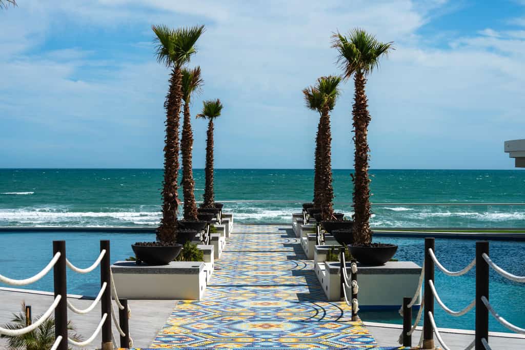 Luxury Ground-Floor 3BR Retreat with Private Patio Steps from the Beach