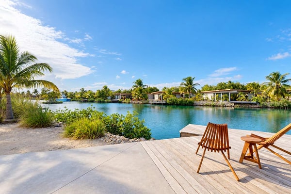 Stay lagoonfront at Seabird, an exclusive boutique community in Placencia. This three-bedroom villa for up to six guests features a private plunge pool and dock, inviting indoor-outdoor living, and access to Seabird's shared community pool and amenities.