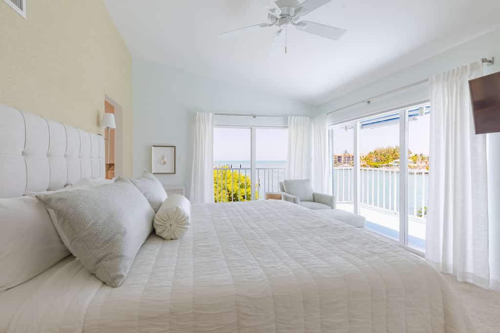 Oceanfront 3BR condo with water views, pool, and boat dock.
