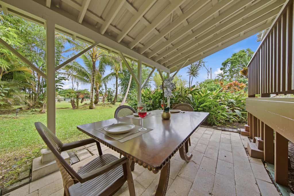 Experience the perfect Hawaiian getaway at this unique property in Keaau featuring two comfortable homes on a single spacious lot. Ideal for families or groups, this peaceful retreat offers a serene garden view, fully equipped kitchens, and relaxing outdoor lanais. Enjoy the convenience of modern amenities including free parking and a full kitchen while being just a short drive from stunning beaches and breathtaking waterfalls. Your tranquil island escape awaits in this beautiful rural setting.