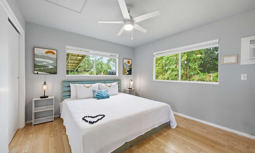 Experience the perfect Hawaiian getaway at this unique property in Keaau featuring two comfortable homes on a single spacious lot. Ideal for families or groups, this peaceful retreat offers a serene garden view, fully equipped kitchens, and relaxing outdoor lanais. Enjoy the convenience of modern amenities including free parking and a full kitchen while being just a short drive from stunning beaches and breathtaking waterfalls. Your tranquil island escape awaits in this beautiful rural setting.