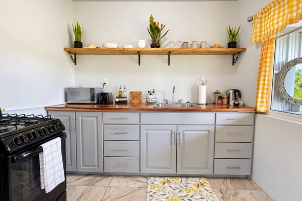 Enjoy modern comfort surrounded by nature at Suburbia Guest House, a peaceful Belmopan studio for two with a private pond, scenic upper deck, king bed, and full kitchen. Relax among tropical greenery while enjoying a comfortable base for exploring Belmopan and the Cayo District.