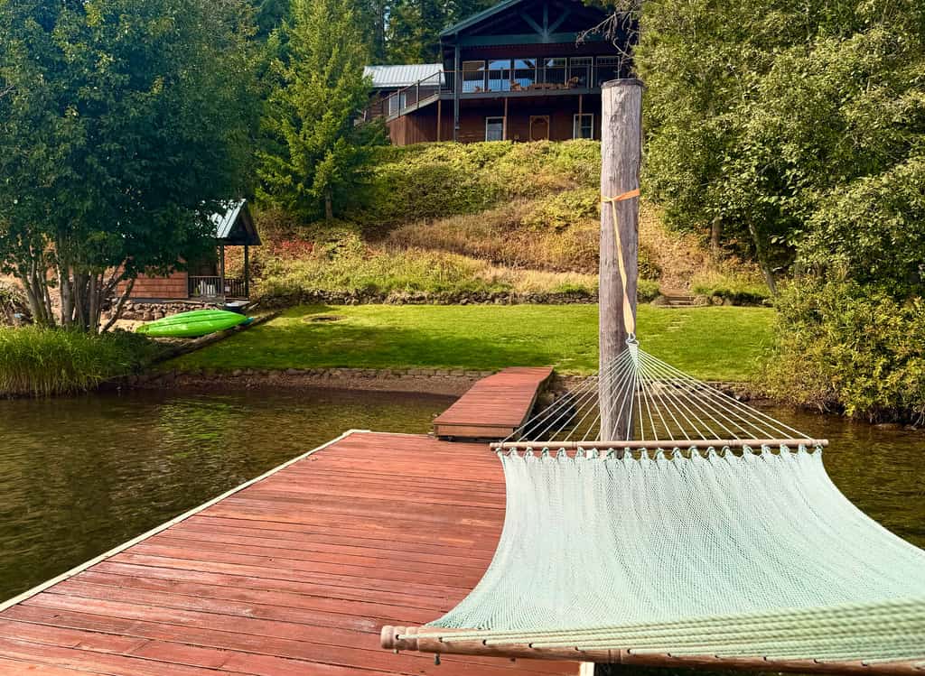 Wake up steps from Lake Coeur d'Alene, grab a kayak, and paddle into your day. Cottonwood Cottage is a 3-bedroom, 1.5-bathroom home on Cottonwood Bay—the quieter, slower side of the lake where you get direct water access without the downtown crowds. Sleep six comfortably, park your boat trailer, and make this your lake-lover's home base.