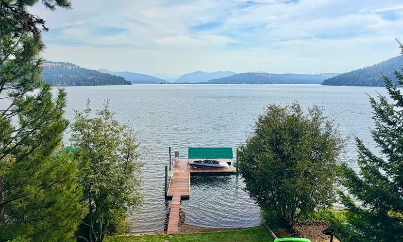 Wake up steps from Lake Coeur d'Alene, grab a kayak, and paddle into your day. Cottonwood Cottage is a 3-bedroom, 1.5-bathroom home on Cottonwood Bay—the quieter, slower side of the lake where you get direct water access without the downtown crowds. Sleep six comfortably, park your boat trailer, and make this your lake-lover's home base.