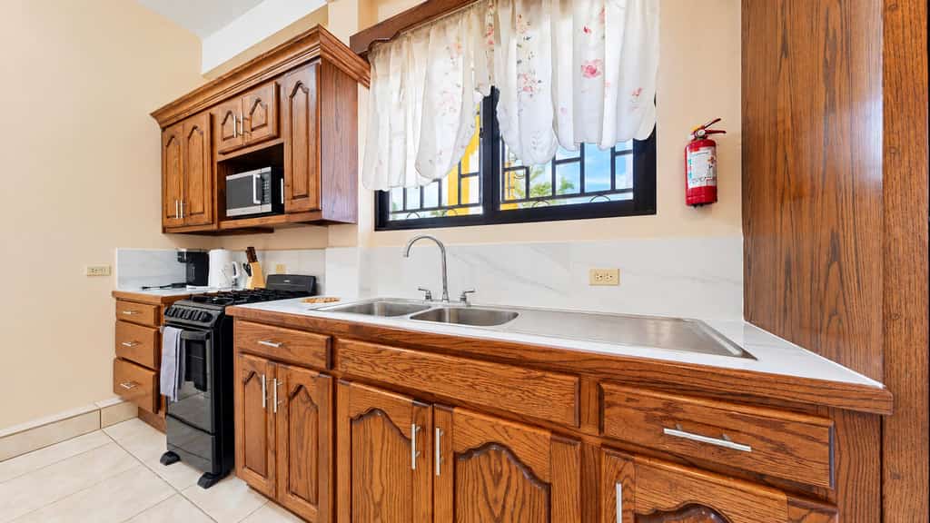 Discover authentic Belizean culture and coastal living at CR Place Vacation Rentals in Dangriga Town. This comfortable ground-floor apartment features an air-conditioned bedroom, in-unit laundry, a full kitchen, high-speed Wi-Fi, and convenient access to local markets and cultural landmarks.