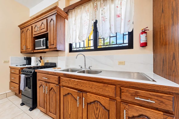 Discover authentic Belizean culture and coastal living at CR Place Vacation Rentals in Dangriga Town. This comfortable ground-floor apartment features an air-conditioned bedroom, in-unit laundry, a full kitchen, high-speed Wi-Fi, and convenient access to local markets and cultural landmarks.
