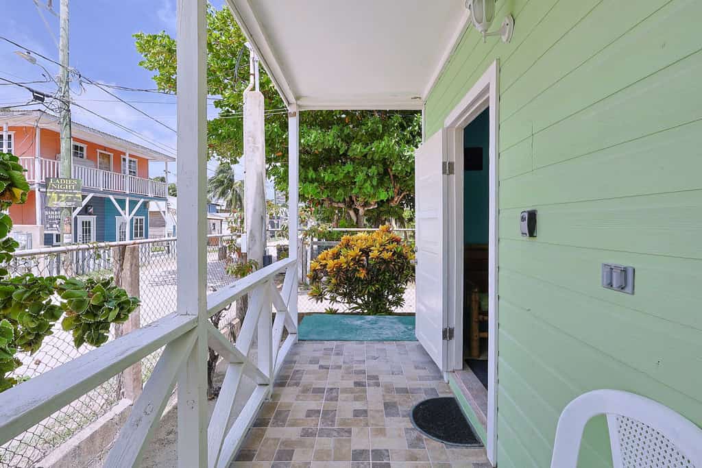 Experience the authentic "Go Slow" lifestyle at Raul's Apartments Unit 2 in Caye Caulker. Ideally situated along one of the island's main streets close to everything, this cozy apartment is an ideal getaway for solo travelers or couples featuring split-unit AC, high-speed Wi-Fi, kitchenette, and a front porch perfect for morning coffee and relaxation.