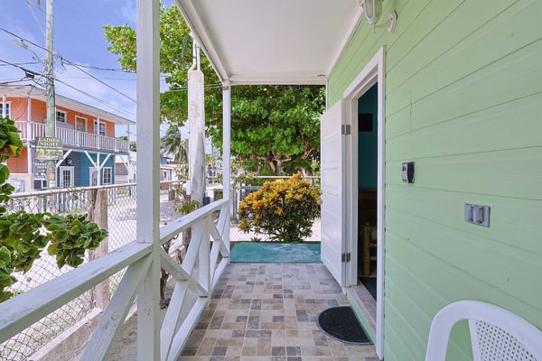 Experience the authentic "Go Slow" lifestyle at Raul's Apartments Unit 2 in Caye Caulker. Ideally situated along one of the island's main streets close to everything, this cozy apartment is an ideal getaway for solo travelers or couples featuring split-unit AC, high-speed Wi-Fi, kitchenette, and a front porch perfect for morning coffee and relaxation.