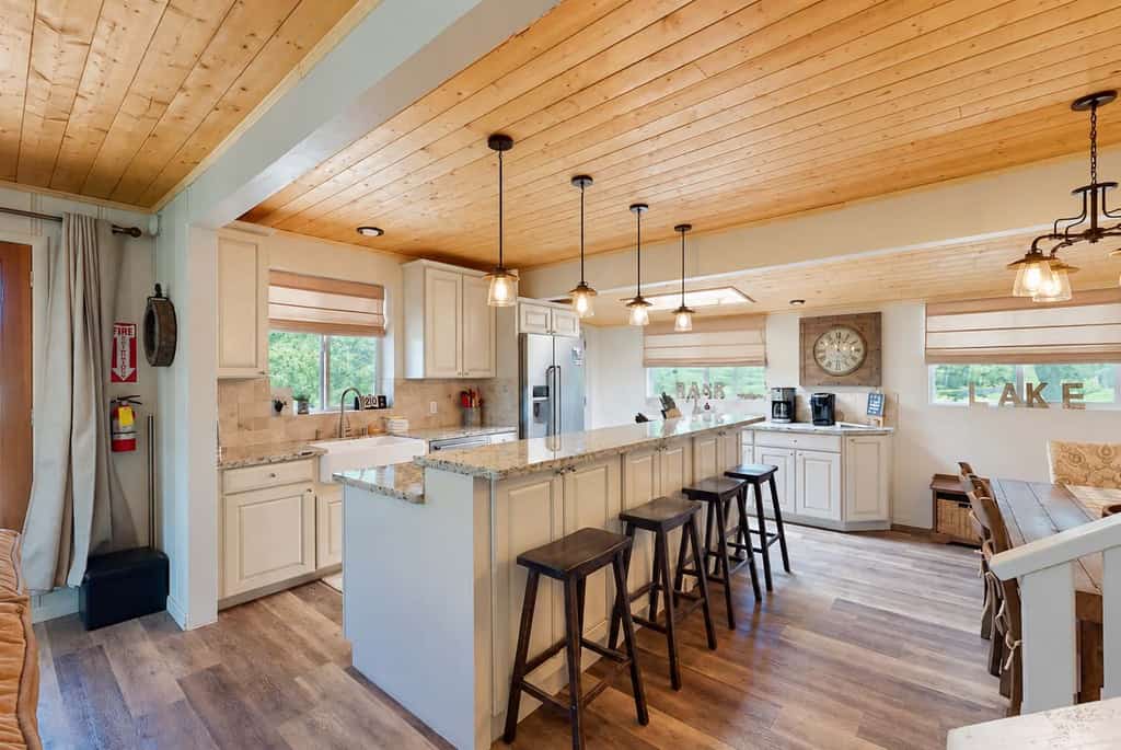 Welcome to Paradise Cove, your lake view retreat on Bass Lake. Wake to shimmering water views, launch a paddle or boat from your private dock, and gather on the rooftop deck for sunset dinners under the stars. This beautifully remodeled four-bedroom home was made for togetherness, with an open living area, a chef's kitchen, and comfortable room for ten. With Yosemite National Park just a short drive away, it is the perfect basecamp for lake days and mountain adventures alike.