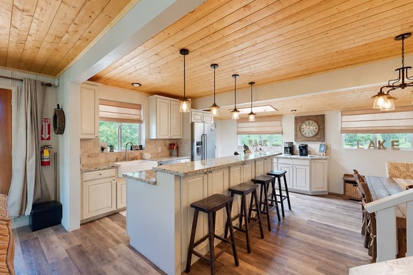 Welcome to Paradise Cove, your lake view retreat on Bass Lake. Wake to shimmering water views, launch a paddle or boat from your private dock, and gather on the rooftop deck for sunset dinners under the stars. This beautifully remodeled four-bedroom home was made for togetherness, with an open living area, a chef's kitchen, and comfortable room for ten. With Yosemite National Park just a short drive away, it is the perfect basecamp for lake days and mountain adventures alike.