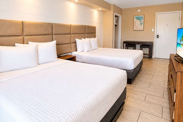 Escape to the coast and enjoy a relaxing Myrtle Beach getaway at 300 Tenth, Unit 225. Ideally located just moments from the ocean, this inviting studio offers the perfect blend of comfort and convenience for your beach vacation.
Featuring two comfortable queen beds, the space is ideal for couples, families, or small groups looking to stay close to the best of Myrtle Beach. A convenient kitchenette makes it easy to keep your favorite drinks and snacks on hand or prepare a quick bite between adventures.
Spend sunny days relaxing by the resort’s outdoor swimming pool or head to the nearby beach for sand, surf, and ocean breezes. When it’s time to unwind, return to your private studio and recharge in comfort.
With a fantastic coastal location, resort-style amenities, and everything you need for an easygoing stay, Unit 225 is a welcoming home base for your Myrtle Beach escape.