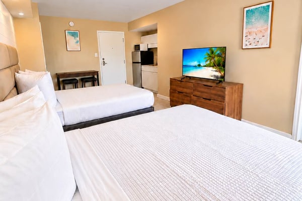 Escape to the coast and enjoy a relaxing Myrtle Beach getaway at 300 Tenth, Unit 225. Ideally located just moments from the ocean, this inviting studio offers the perfect blend of comfort and convenience for your beach vacation.
Featuring two comfortable queen beds, the space is ideal for couples, families, or small groups looking to stay close to the best of Myrtle Beach. A convenient kitchenette makes it easy to keep your favorite drinks and snacks on hand or prepare a quick bite between adventures.
Spend sunny days relaxing by the resort’s outdoor swimming pool or head to the nearby beach for sand, surf, and ocean breezes. When it’s time to unwind, return to your private studio and recharge in comfort.
With a fantastic coastal location, resort-style amenities, and everything you need for an easygoing stay, Unit 225 is a welcoming home base for your Myrtle Beach escape.