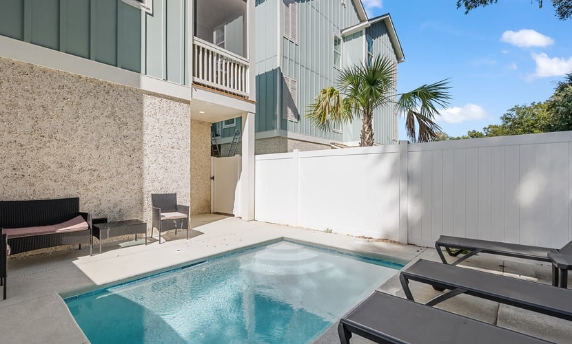 Escape to paradise where there is plenty of space for family and friends in this three-story townhome in The Homes at Olive Shell. The 4-bedroom home sleeps up to 10 guests and features two king bedrooms, two queen bedrooms, a private plunge pool, multiple screened porches, a spacious garage with golf simulator and arcade, and access to community amenities including a resort-style pool, walking trails, cornhole, and foosball. Enjoy easy access to North End dining, golf, fishing, and island attractions.
