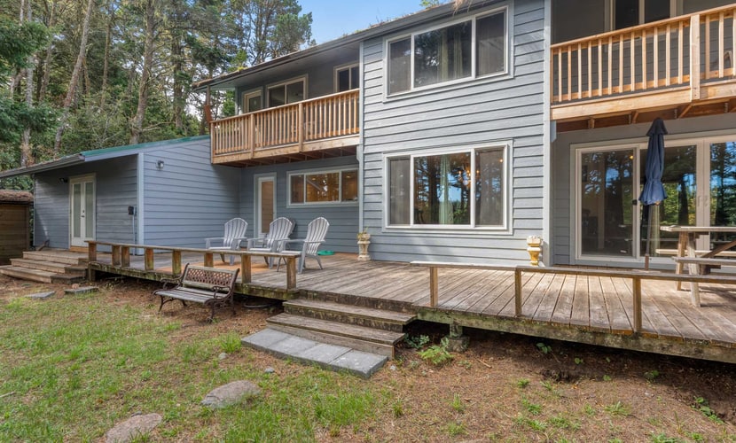 Lakefront Retreat Steps from the Water with Decks & Peaceful Wooded Backyard