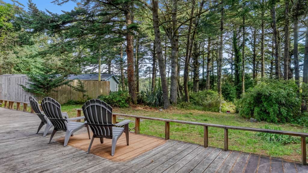 Lakefront Retreat Steps from the Water with Decks & Peaceful Wooded Backyard