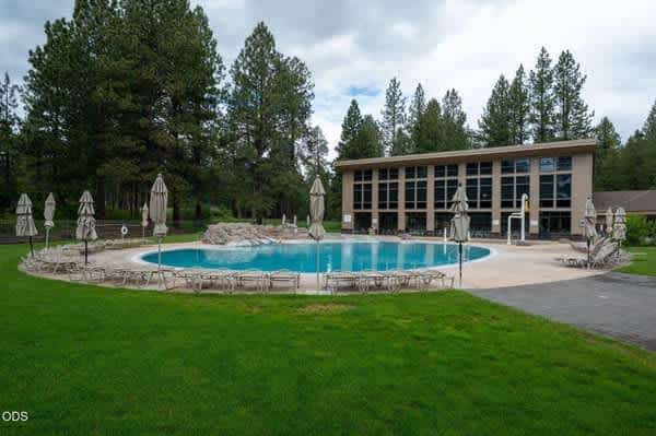 Stunning modern mountain home with gourmet kitchen, a cozy fireplace, and a private outdoor patio with a hot tub and fire pit. Explore resort-style amenities, including golf, swimming, tennis, and scenic biking.