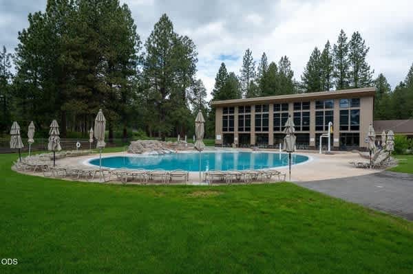 Stunning modern mountain home with gourmet kitchen, a cozy fireplace, and a private outdoor patio with a hot tub and fire pit. Explore resort-style amenities, including golf, swimming, tennis, and scenic biking.