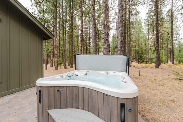 Stunning modern mountain home with gourmet kitchen, a cozy fireplace, and a private outdoor patio with a hot tub and fire pit. Explore resort-style amenities, including golf, swimming, tennis, and scenic biking.