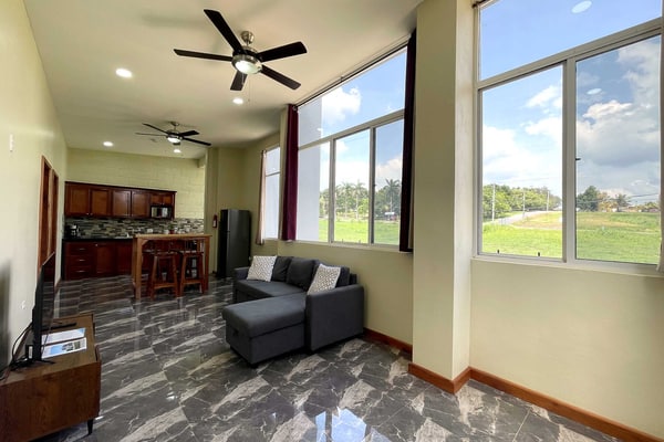 Stay in comfort in this brand-new, modern 2-bedroom, 2-bathroom apartment at Crown Heights in San Ignacio, Cayo District, Belize. It’s bright, airy and spacious, with air-conditioned bedrooms, a fully equipped kitchen and parking, and it sleeps 4. You’re close to town, Maya ruins, caves, rivers and jungle adventures, so it makes an easy base for exploring western Belize.