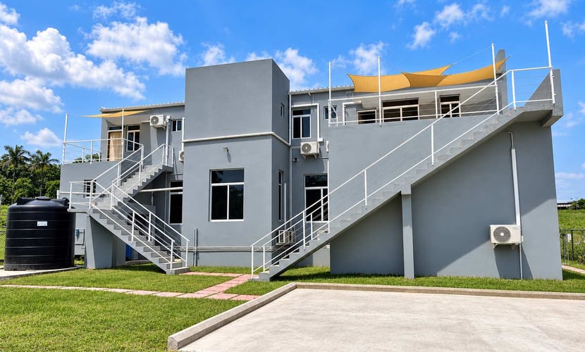 This brand-new 2-bedroom, 2-bathroom apartment at Crown Heights is a modern, comfortable home base in San Ignacio, Belize. It sleeps 4, with two queen bedrooms that each have air conditioning, a fully equipped kitchen and on-site parking. Spend your days exploring Maya temples, caves and rivers across the Cayo District, then come back to a bright, spacious place to relax.