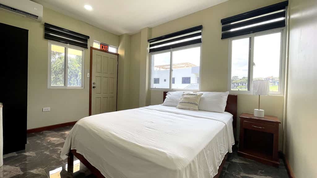 This brand-new 2-bedroom, 2-bathroom apartment at Crown Heights is a modern, comfortable home base in San Ignacio, Belize. It sleeps 4, with two queen bedrooms that each have air conditioning, a fully equipped kitchen and on-site parking. Spend your days exploring Maya temples, caves and rivers across the Cayo District, then come back to a bright, spacious place to relax.