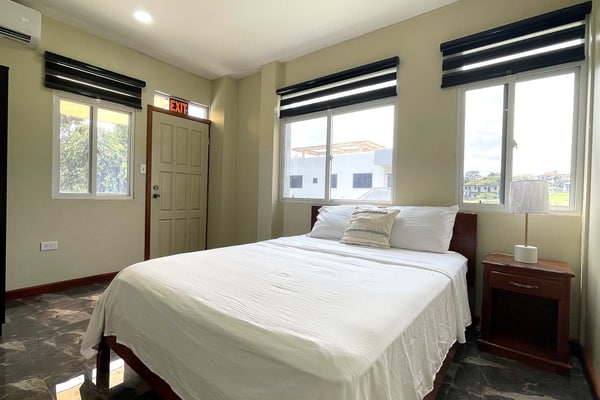 This brand-new 2-bedroom, 2-bathroom apartment at Crown Heights is a modern, comfortable home base in San Ignacio, Belize. It sleeps 4, with two queen bedrooms that each have air conditioning, a fully equipped kitchen and on-site parking. Spend your days exploring Maya temples, caves and rivers across the Cayo District, then come back to a bright, spacious place to relax.