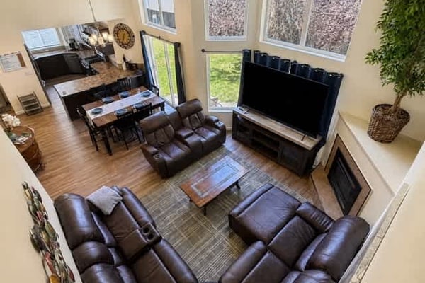 Settle into a bright, comfortable home designed for easy group stays and longer visits. This 3-bedroom, 3-bath townhouse sleeps up to 8 guests and offers a convenient home base in Midtown Coeur d'Alene. Gather indoors with family and friends—the full kitchen, board games, fireplace, and spacious layout invite you to cook together, play, and relax. Private parking, in-unit laundry, and fast WiFi make extended stays effortless. Downtown, shops, and restaurants are within easy reach