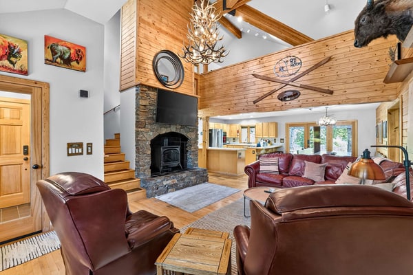 A spacious, pet-friendly five-bedroom mountain retreat along Lake Fork Creek, just 5 miles from downtown McCall. Surrounded by pines, this cabin sleeps up to 12 and features an indoor hot tub, two main-level primary suites, a game loft with foosball, and a large deck overlooking the river. Enjoy a creekside fire pit, outdoor seating, and plenty of space for gathering, with convenient access to year-round recreation.
