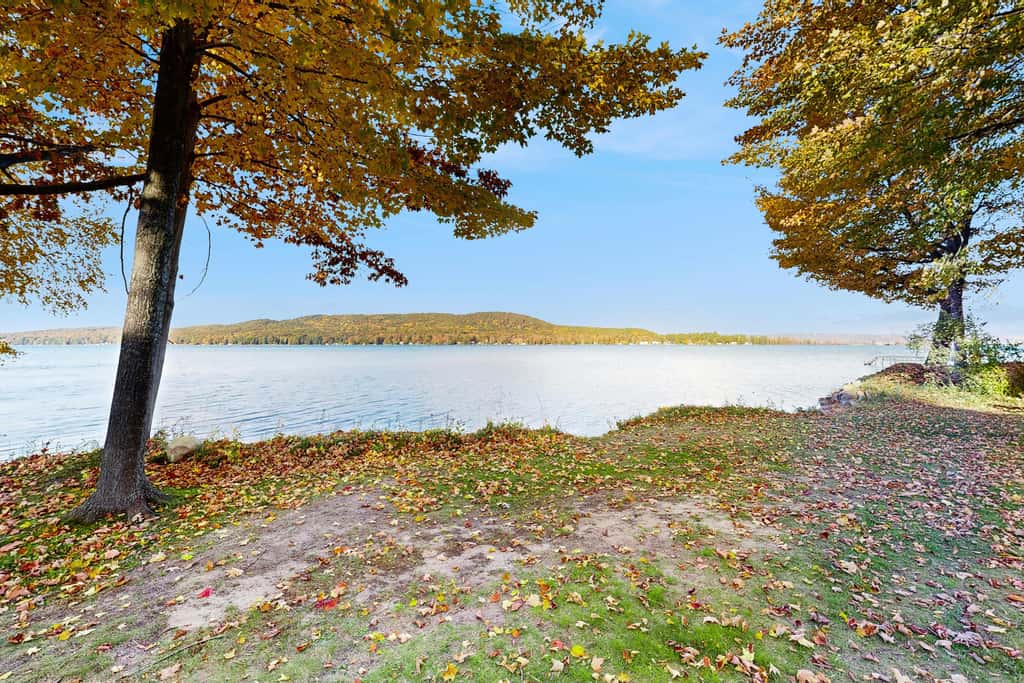 Lakefront retreat with 3 dwellings, fire pit, dock, kayaks, paddleboards & stunning Glen Lake views