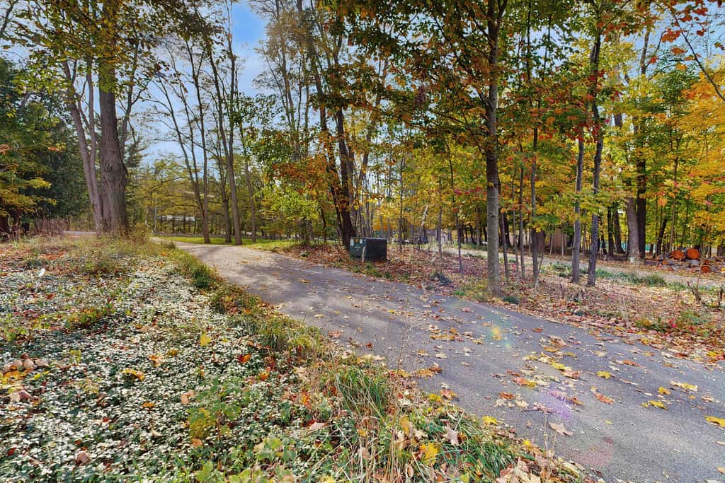 Lakefront retreat with 3 dwellings, fire pit, dock, kayaks, paddleboards & stunning Glen Lake views
