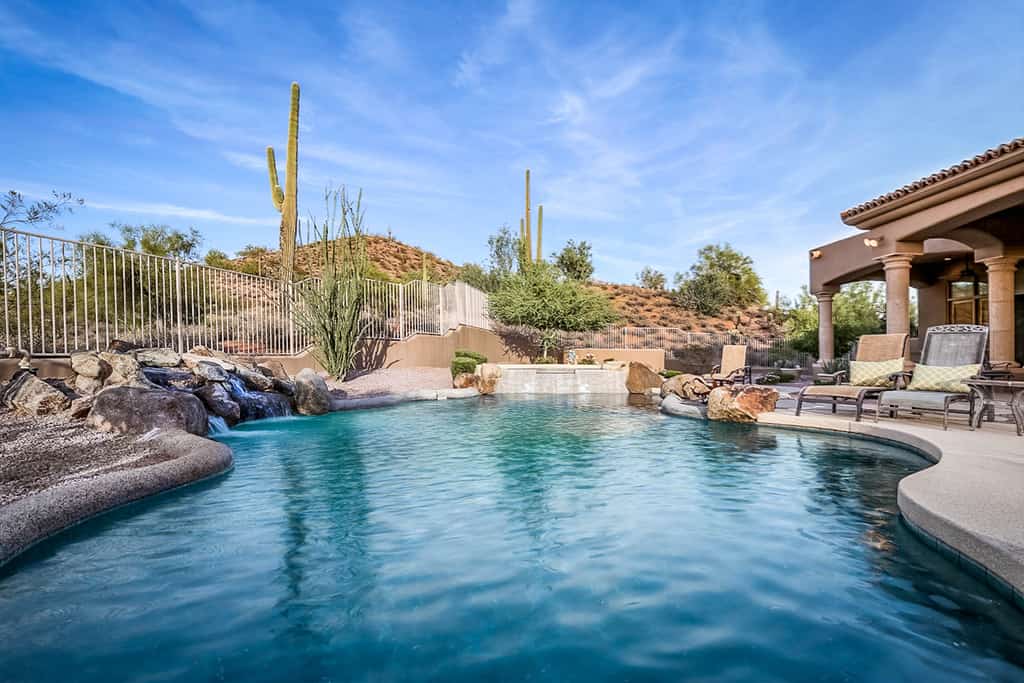 Outdoor pool with desert landscaping located in Scottsdale, AZ