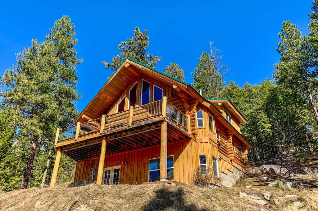 Large wood cabin in Cascade, ID with a wrap around porch