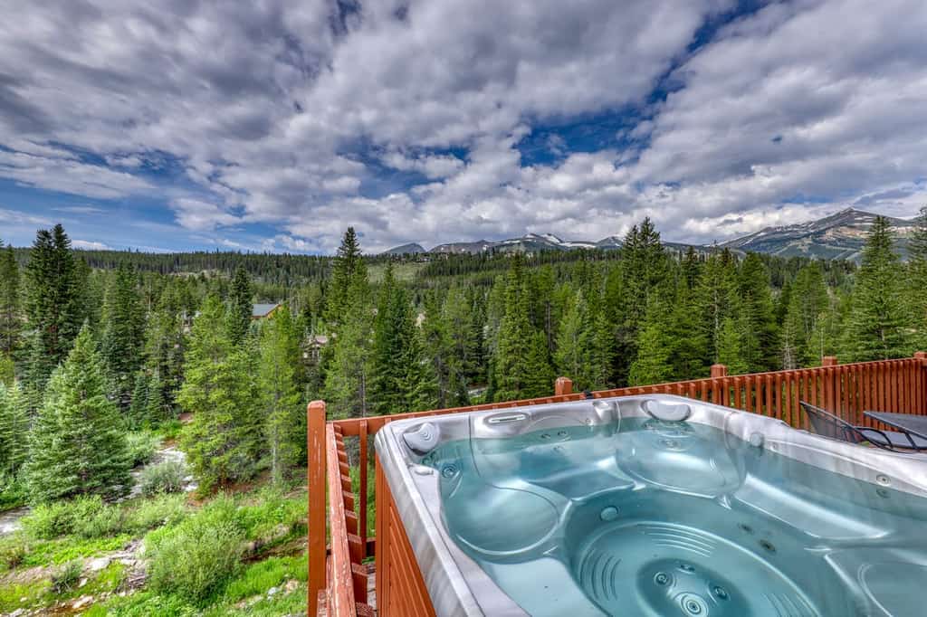 Riverfront cabin hot tub overlooking forest in Colorado