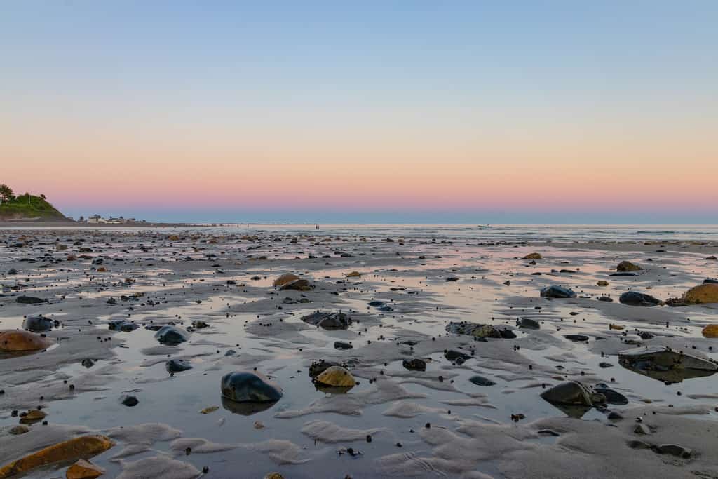 The receding tied during a sunset on Wells Beach.