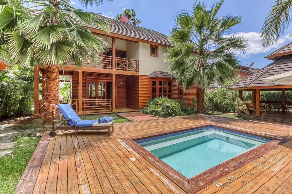 backyard pool of Jarabacoa, La Vega vacation rental surrounded by palm trees