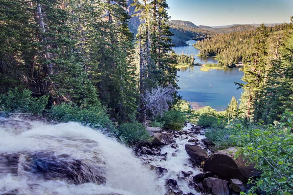 waterfall rushing into lake in mammoth lakes, ca