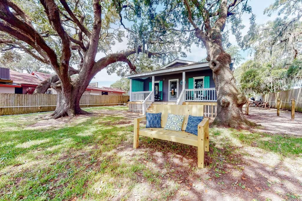 Wood bench in the backyard of a vacation rental in Litchfield, SC