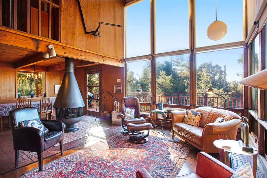 cozy interior with unique circular fireplace in Mendocino, CA vacation home