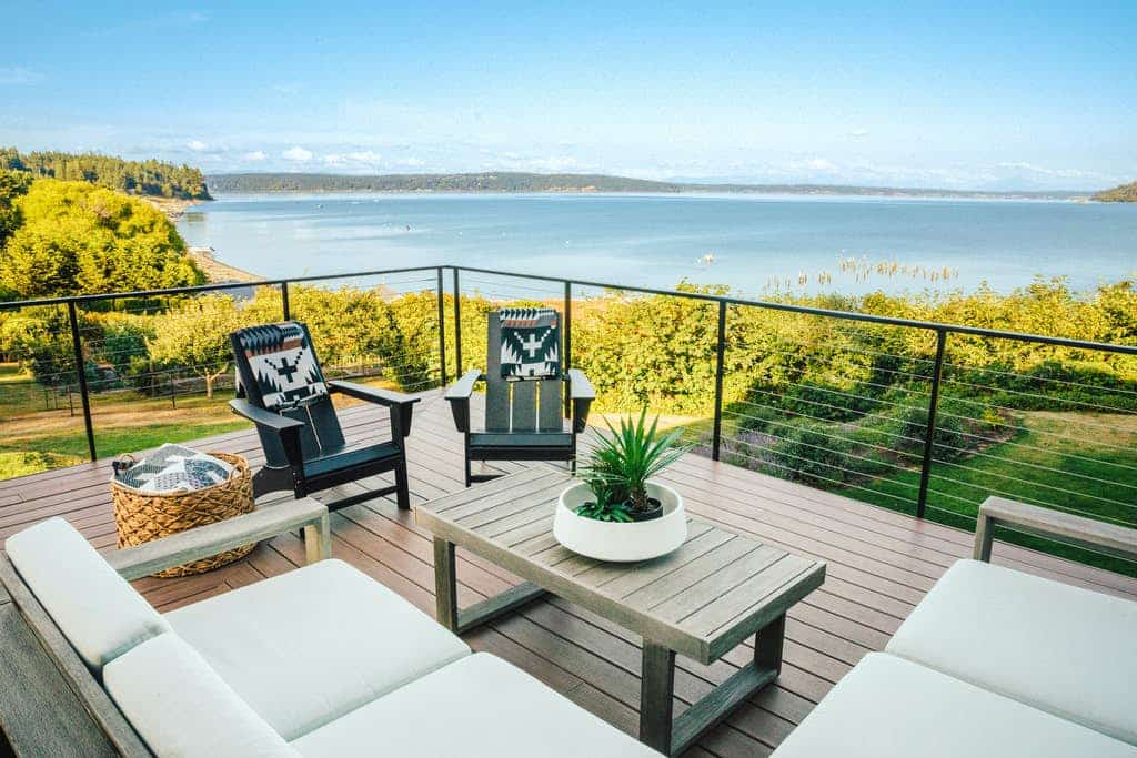 waterfront vacation home with well-appointed outdoor furnishings and decor