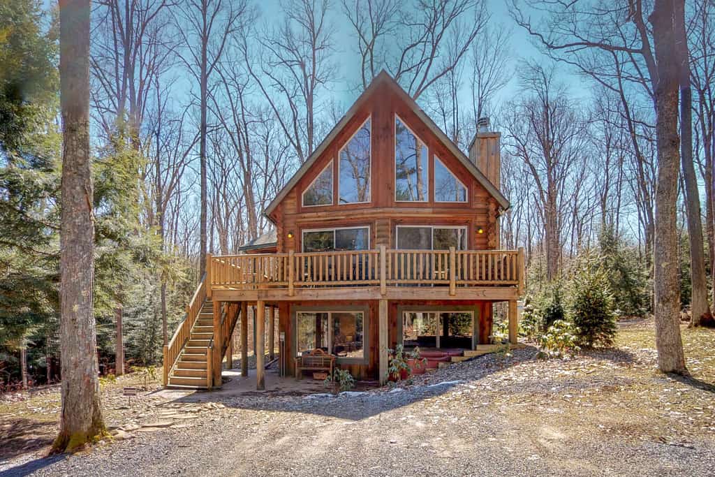 Wooden cabin with a wrap around deck in Deep Creek Lake, MD