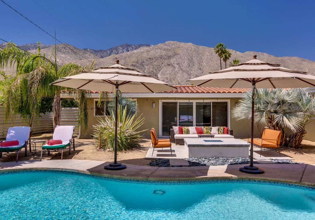 beautiful backyard with private pool and lounge chairs in palm springs, ca