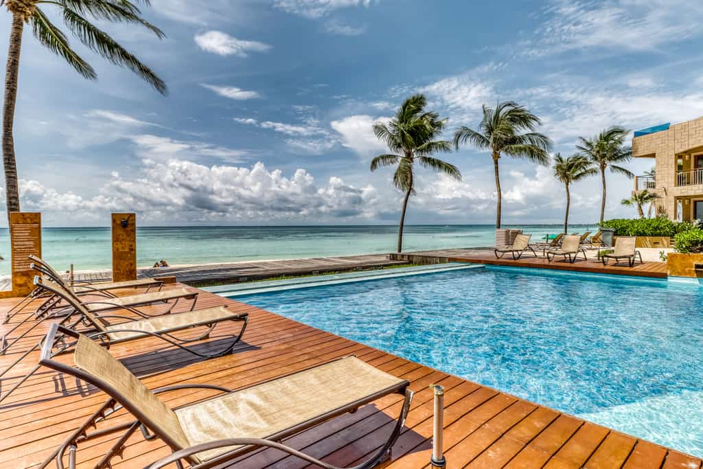 Vacation rental resort with a pool overlooking the ocean.