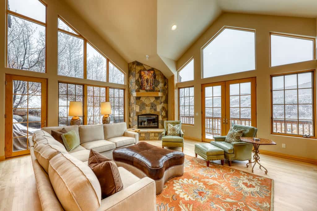 high ceilings and stone fireplace of vail, co vacation home