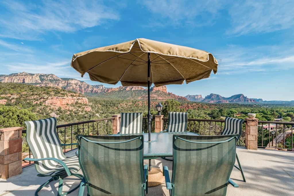 Sedona vacation rental patio with outdoor table and chairs and red rock views.