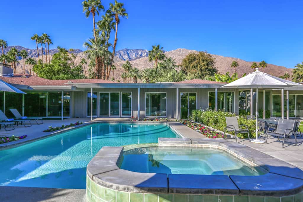 outdoor pool and hot tub of palm springs home with mountain views
