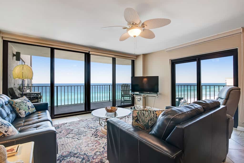 The living room of a condo rental in Panama City Beach, FL overlooking the beach.