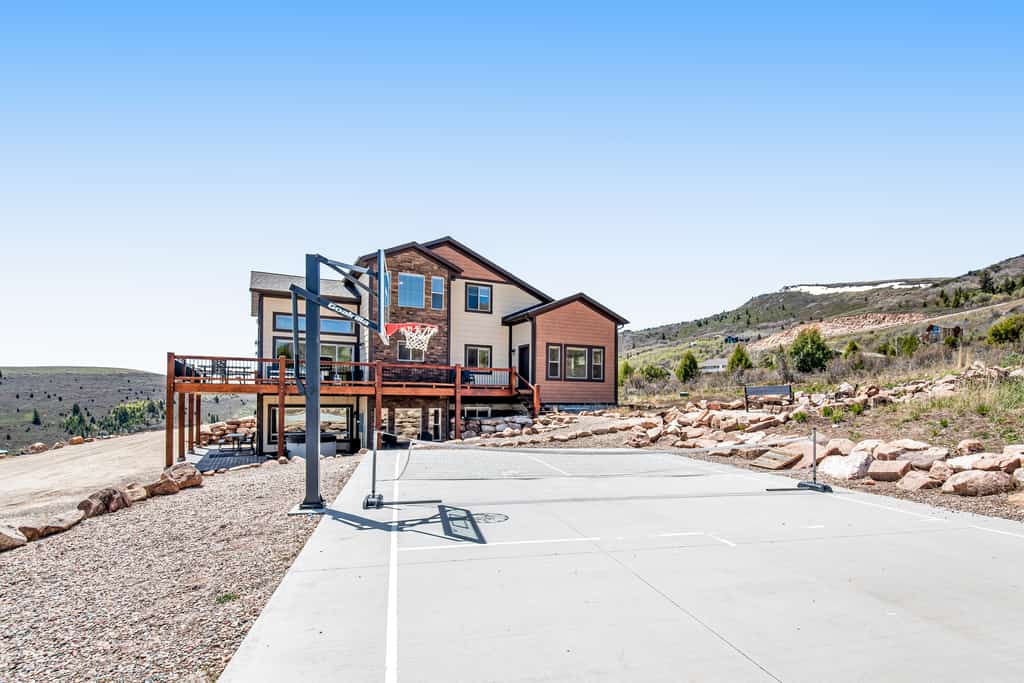A large house in Utah with a basketball court.